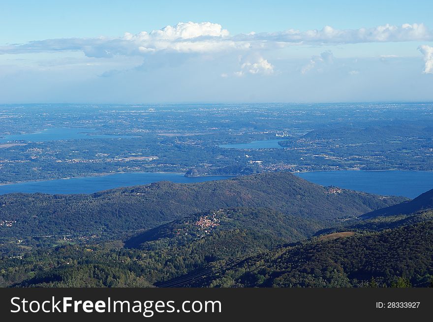 Panorama of Lakes and Northern Italy from mountain Mottarone, part of Alps