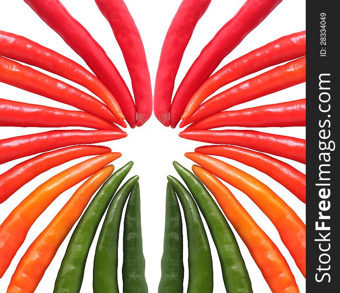 Colorful hot chillies arranged circularly isolated on white background. These farm fresh chilies are in red, orange, yellow and green colors. Colorful hot chillies arranged circularly isolated on white background. These farm fresh chilies are in red, orange, yellow and green colors.