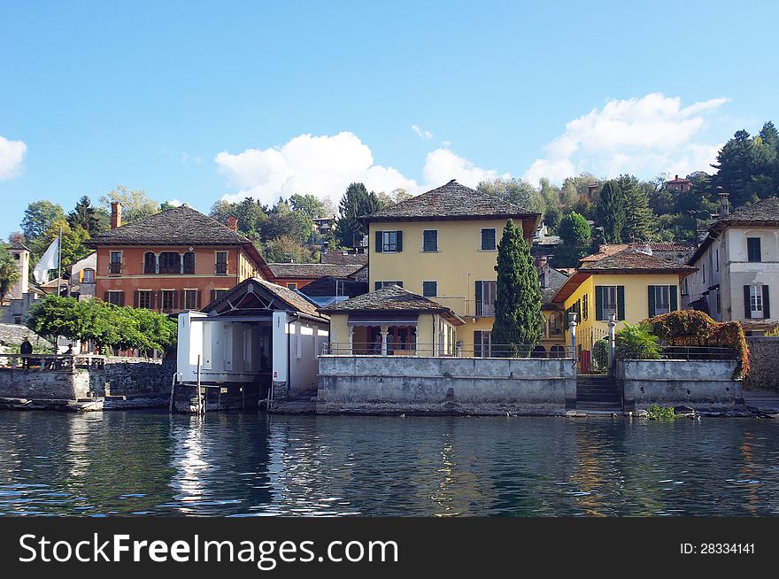 Garage for boats in town Orta San Giulio, Orta Lake, Italy. Garage for boats in town Orta San Giulio, Orta Lake, Italy