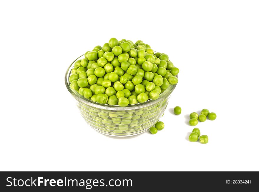 Pea balls in glass bowl on white background.