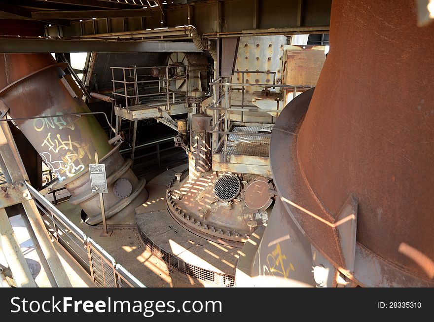 An old furnace in a steel production facility. An old furnace in a steel production facility.