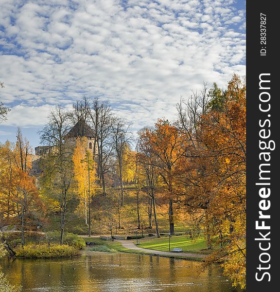 Old autumnal park and ancient Castle.