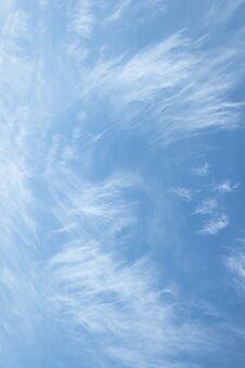 Wispy And Transparent Clouds. Vertical Background With High Gentle Clouds. Royalty Free Stock Photos