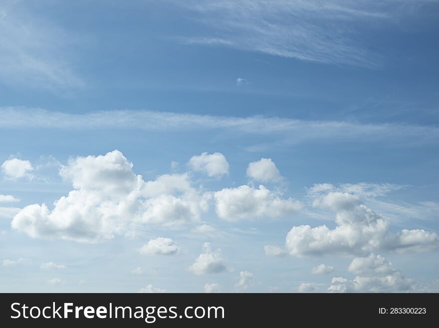 Low cumulus and wispy high clouds background.