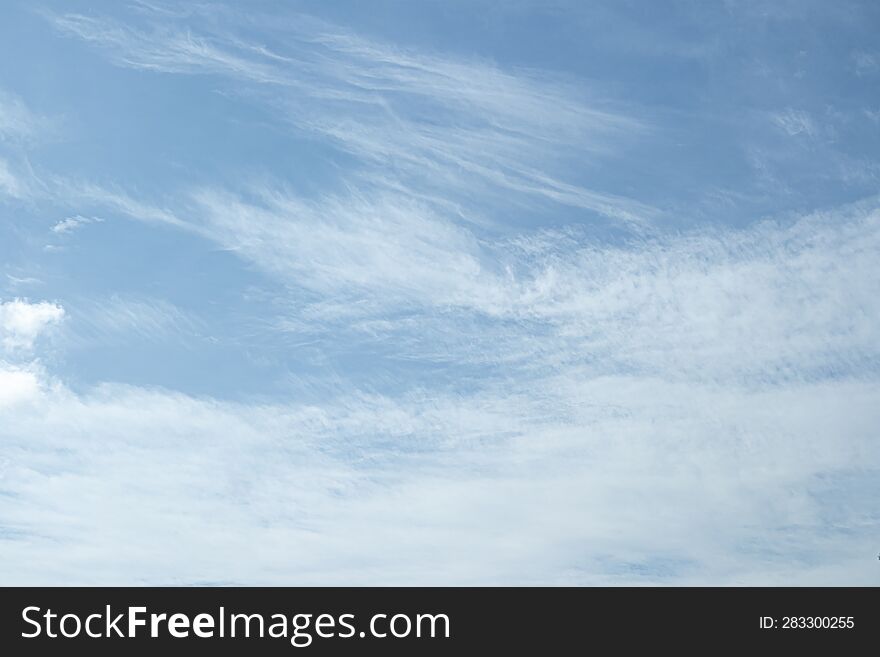 Transparent high clouds in summer background.