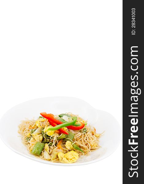 Rice noodle stir-fired with egg and vegetables isolated on white background.