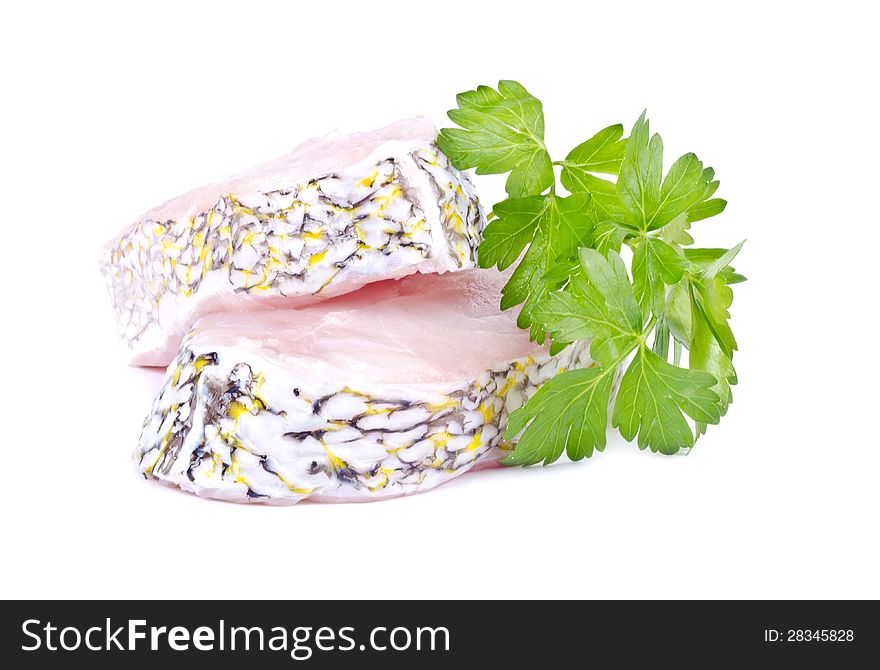 Two grouper steaks with parsley isolated on white. Two grouper steaks with parsley isolated on white.