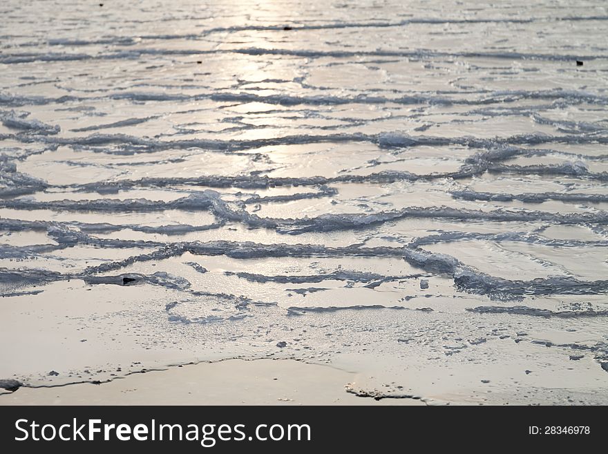 Ice on the sea in the light of the soft coming sun