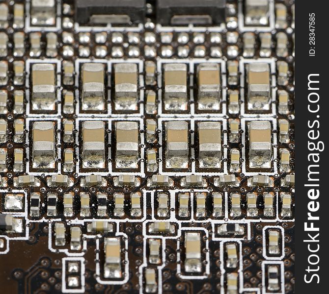 A macro shot of an electronic circuit – square image. A macro shot of an electronic circuit – square image