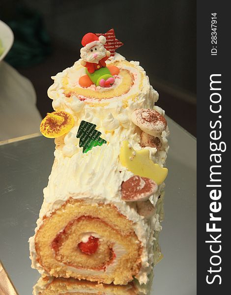Close up of cake with Santa doll. Close up of cake with Santa doll