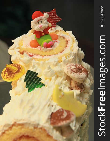 Close up of cake with Santa doll. Close up of cake with Santa doll
