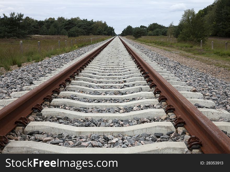 Renewed line with concrete sleepers far behind the horizon. Renewed line with concrete sleepers far behind the horizon