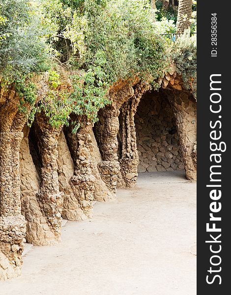 Barcelona’s Park Guell stone colonnaded pathway. Spain.