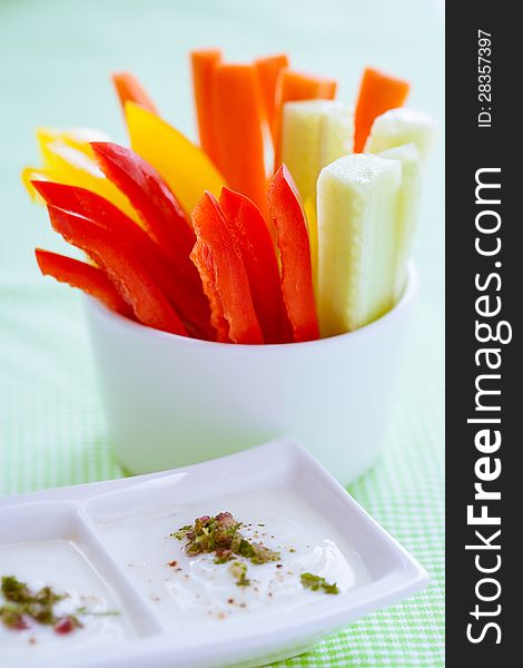 Carrots, cucumber and pepper sticks with dip. Carrots, cucumber and pepper sticks with dip