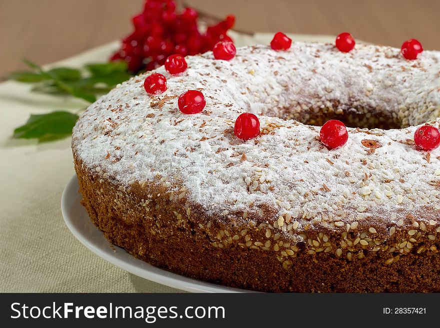 Piece of cake on a white plate with berries