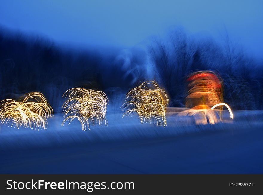 An Artistic background of Christmas trees at night