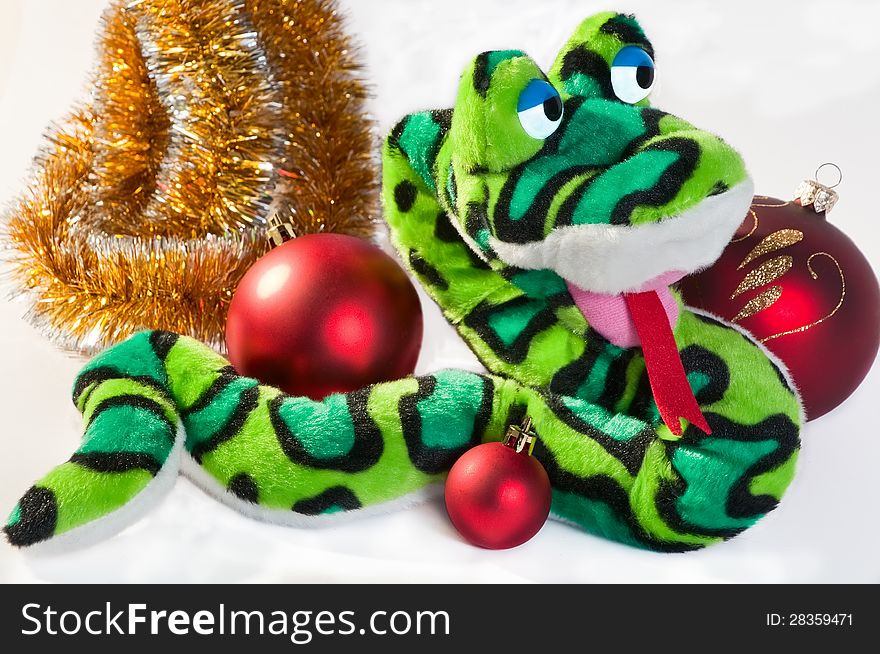 New Year symbol snake with Christmas balls and garland isolated on white