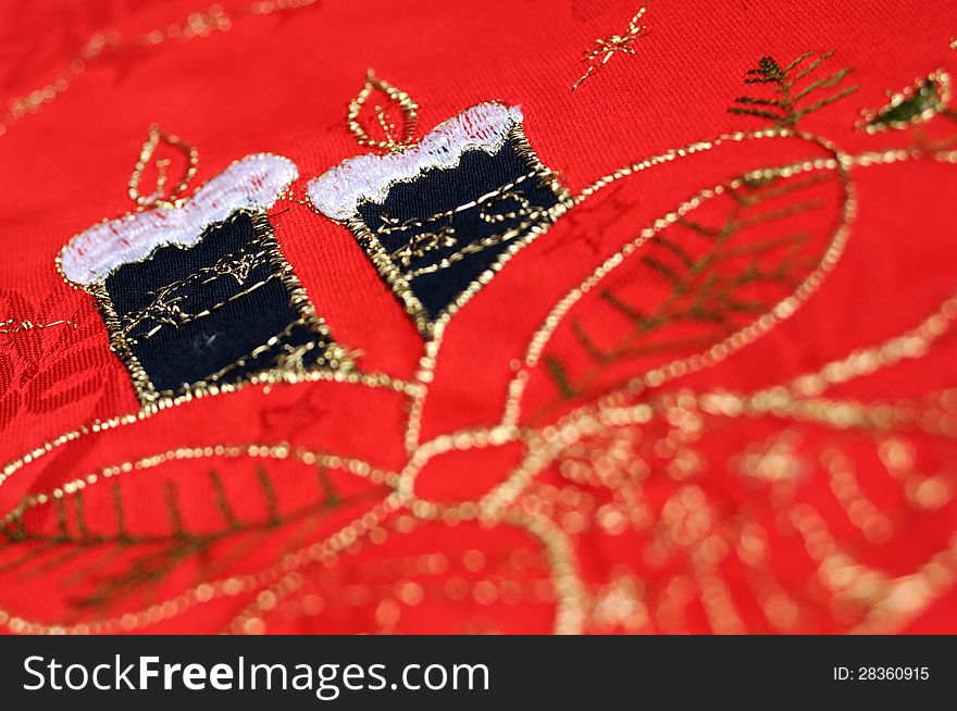 Red christmas table cloth with two candles. Red christmas table cloth with two candles