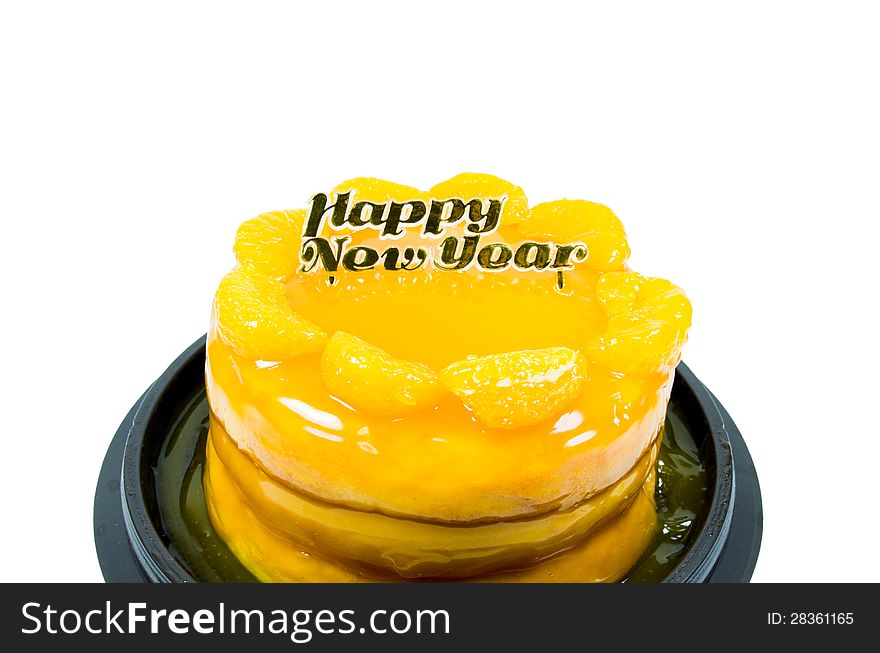 Orange cake with golden happy new year text  isolated