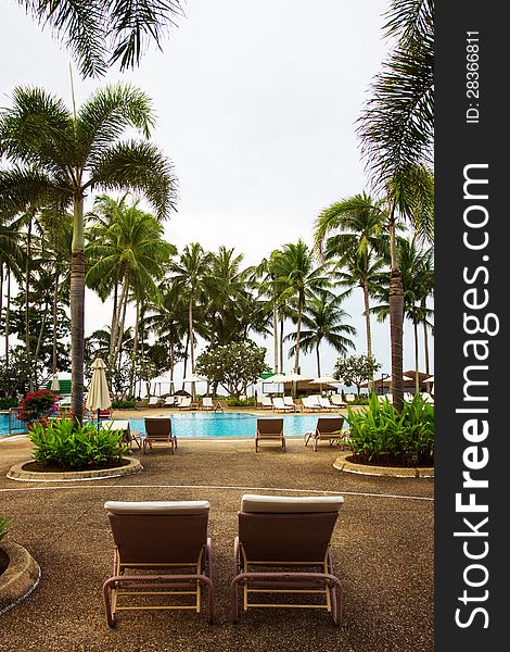 Swimming pool area, tropical resort, without people