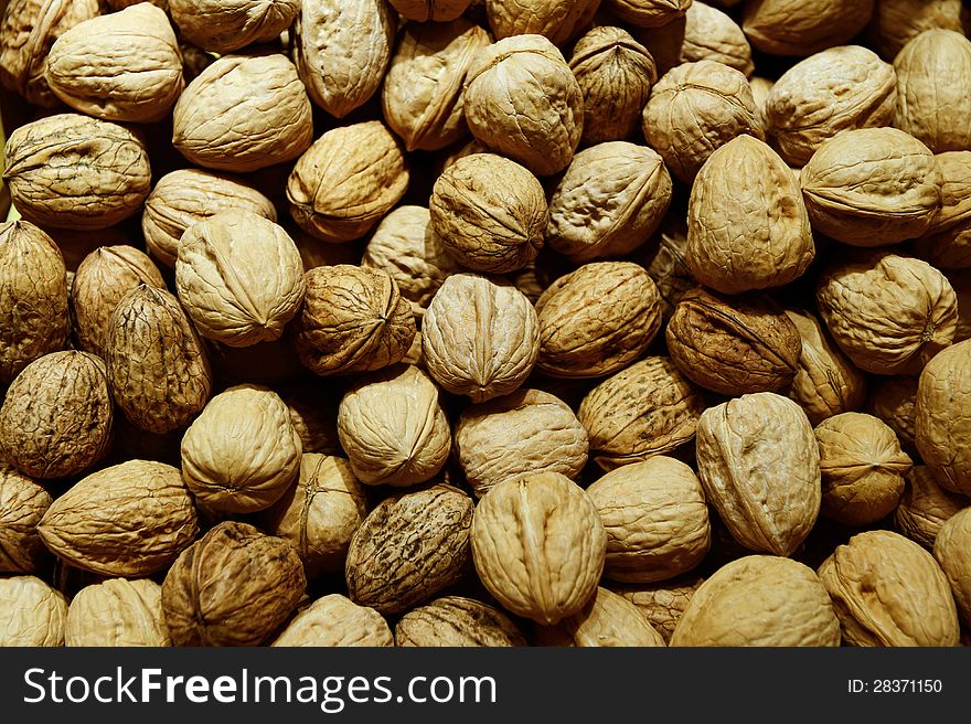 Heap of walnuts on a market stall