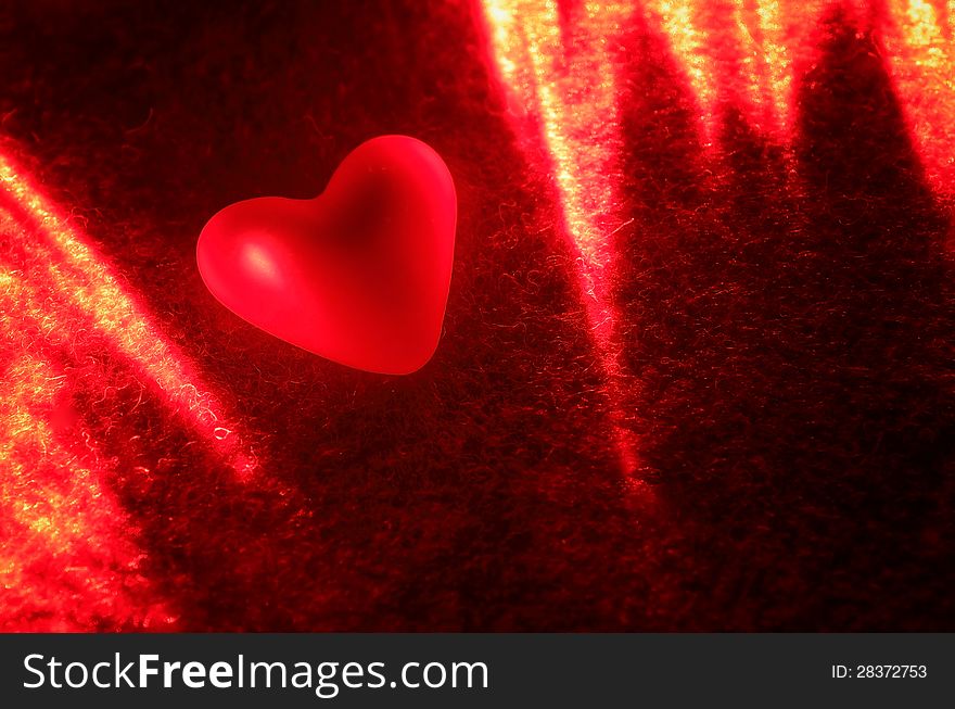 Heart in the light of the laser. Background Valentine's Day