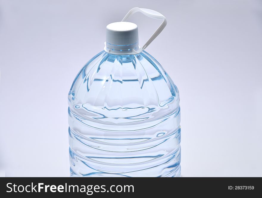 Plastic water bottle with white cap. Plastic water bottle with white cap