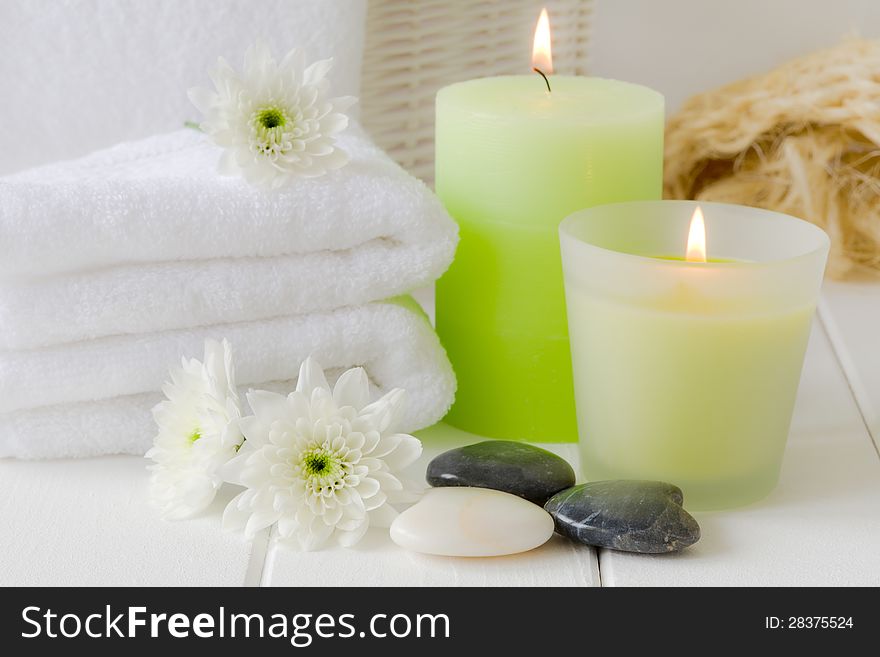 Wellness paraphernalia, soft towels, therapy stones and candles. Wellness paraphernalia, soft towels, therapy stones and candles