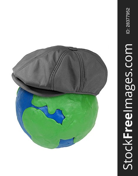 Plasticine globe earth and man's hat on a white background. Plasticine globe earth and man's hat on a white background