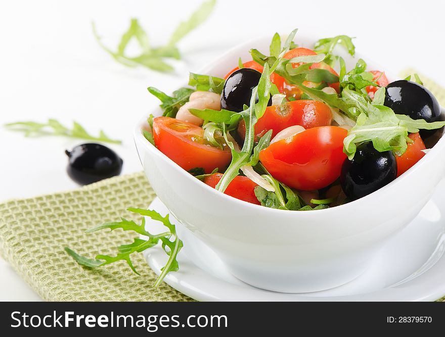 Healthy beans salad on a white plate