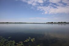 Free Lake And The Opposite Shore On The Horizon On A Summer Day In The Italian Countryside Stock Images - 283704534