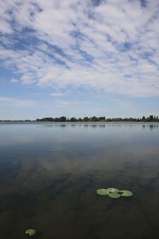 Free Lake And The Opposite Shore On The Horizon On A Summer Day In The Italian Countryside Royalty Free Stock Image - 283704646