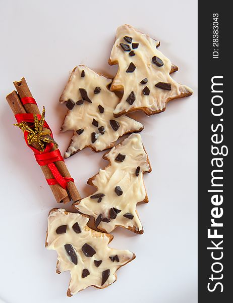 Christmas cookies with white chocolate and decoration on a white background