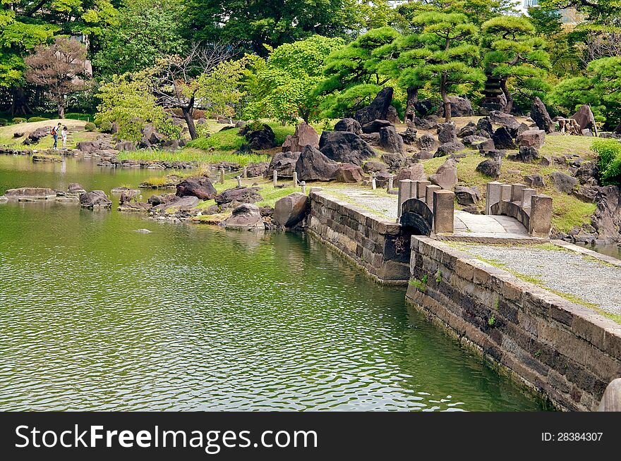 Formal garden, man made, color image, ornamental garden, residential garden, beauty in nature, Japan culture, wilderness area, national landmark, residential district, Japanese garden, rock garden, bridge across pond. Formal garden, man made, color image, ornamental garden, residential garden, beauty in nature, Japan culture, wilderness area, national landmark, residential district, Japanese garden, rock garden, bridge across pond