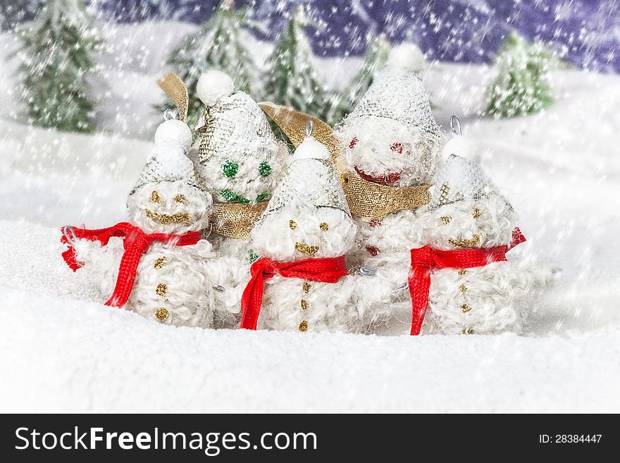 Happy and smiling snowmen in the winter scenery. Happy and smiling snowmen in the winter scenery