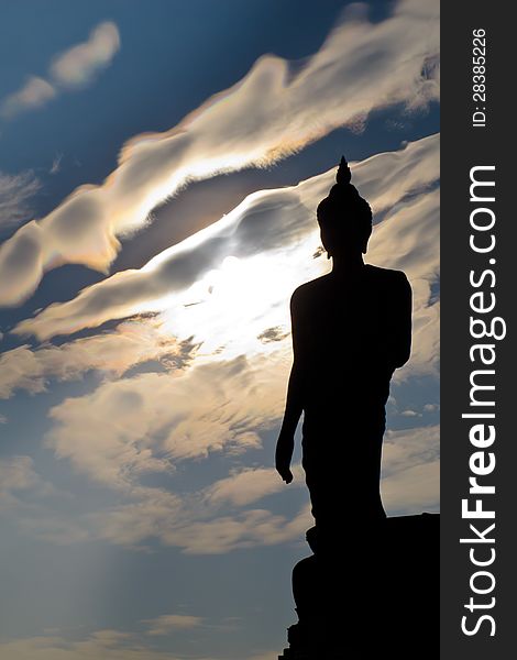 Silhouette of buddha statue with white cloud at Phutthamonthon, Thailand