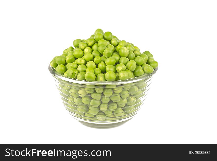 Pea balls in glass bowl on white background.