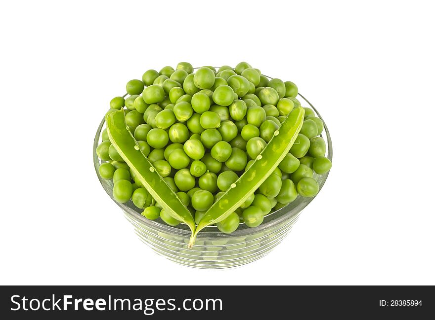 Pea balls in glass bowl on white background.