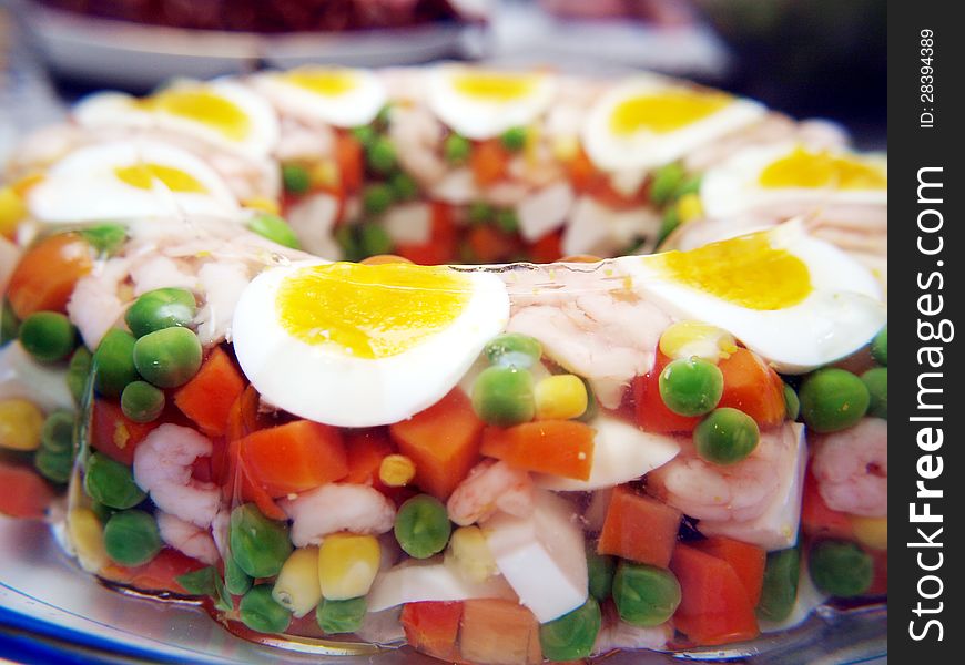 Aspic with eggs and shrimps, and vegetables
