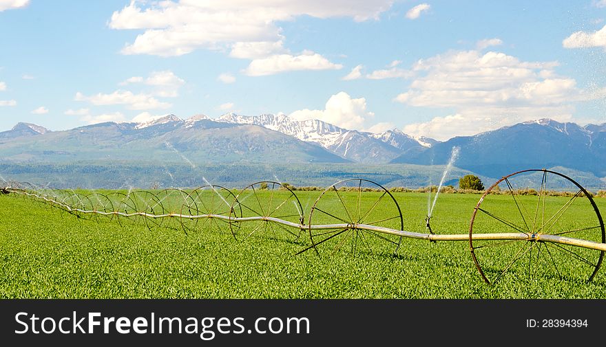 Irrigation System on Farm with San Juan Mountains in Background