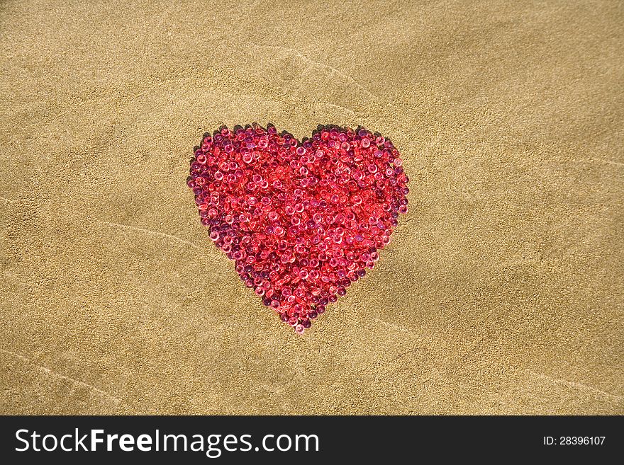 Heart shape drawn on sand