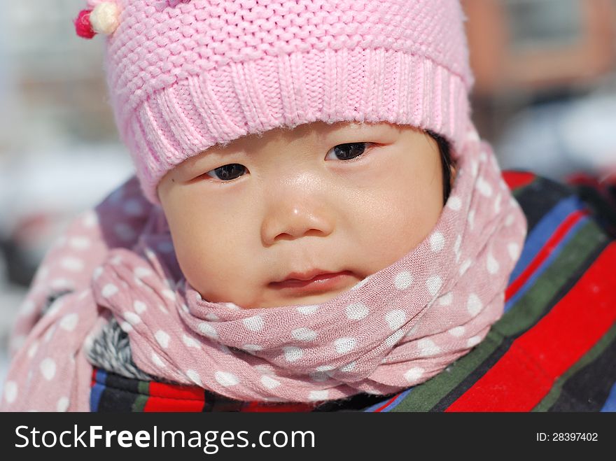 Chinese girl wearing a hat scarf. Chinese girl wearing a hat scarf