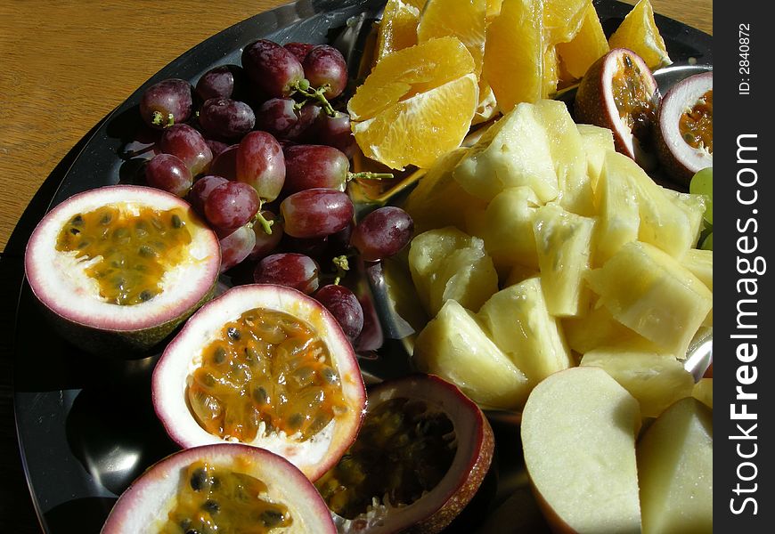 A large plate of assorted Tropical fruit. A large plate of assorted Tropical fruit