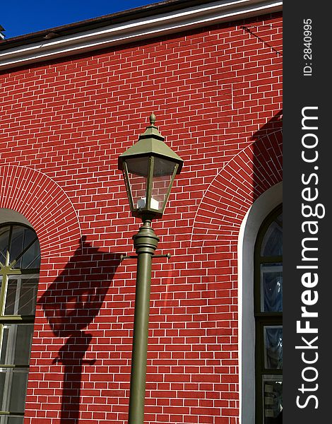 Street lamp on the red wall background