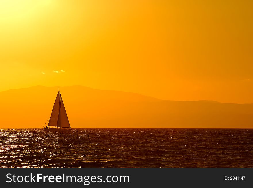 A sailing boat traveling the Mediterranean