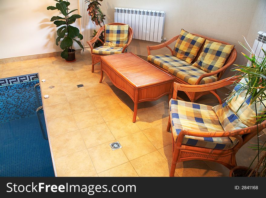 Sofa, armchairs and a table at pool in hotel. Sofa, armchairs and a table at pool in hotel