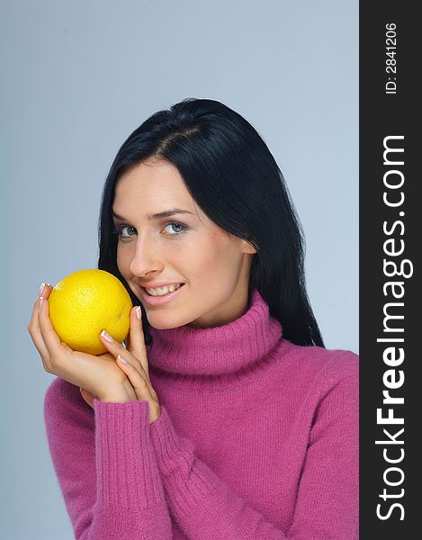 Portrait of woman with grapefruit