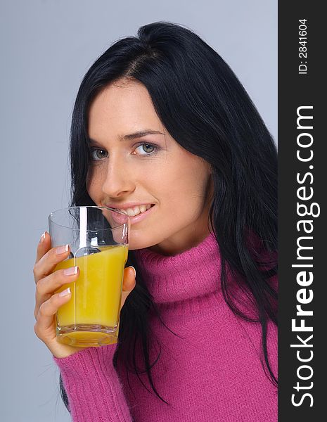 Pretty woman with orange juice