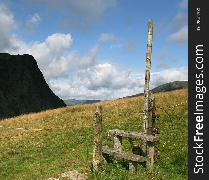 A stile across a wire fence in the English Lake district