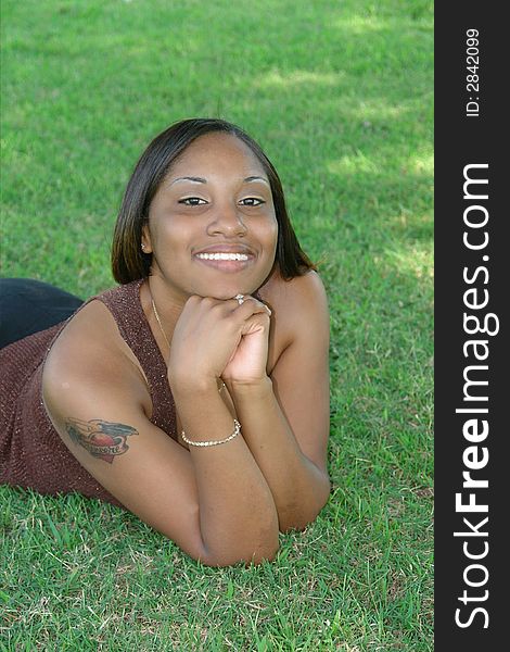 A picture of a beautiful young woman  lying in the shade. A picture of a beautiful young woman  lying in the shade